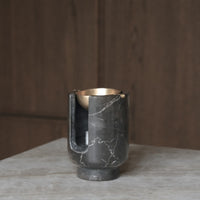 AURA oil burner from BRANDT Collective in shadow black marble an brass bowl