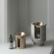 AURA oil burner in chalk grey beige marble and brass bowl by BRANDT Collective