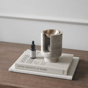 AURA oil burner in chalk grey beige marble and brass bowl by BRANDT Collective