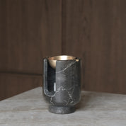 AURA oil burner from BRANDT Collective in shadow black marble an brass bowl