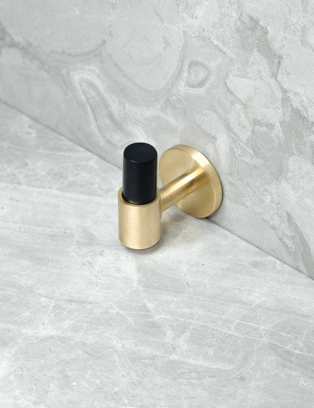 END knob in Brushed Brass/Black Horn. Luxury cabinet hardware made of solid brass by BRANDT Collective.