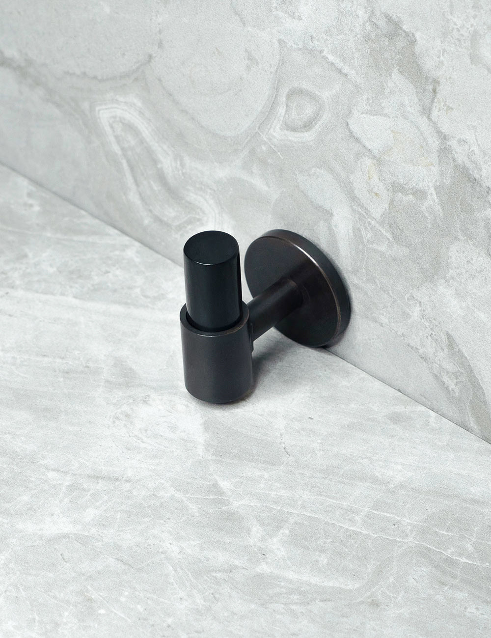 END knob in Nearly Black/Black Horn. Luxury cabinet hardware made of solid brass by BRANDT Collective.