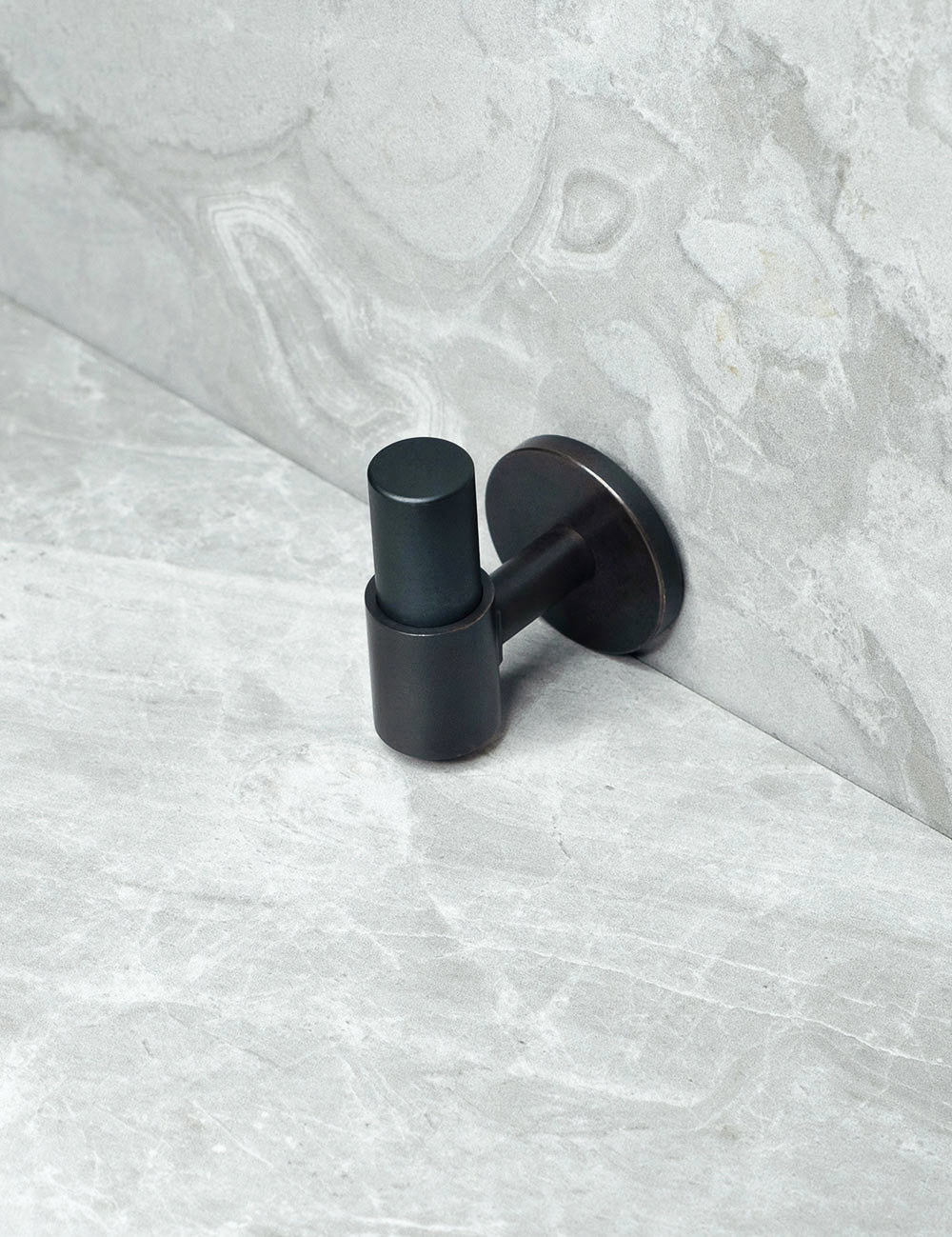 END knob in Nearly Black/Nearly Black. Luxury cabinet hardware made of solid brass by BRANDT Collective.