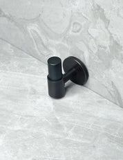 SIGNATURE 30 END knob in Nearly Black/Nearly Black. Luxury cabinet hardware made of solid brass by BRANDT Collective.