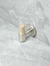 SIGNATURE 30 END knob in Brushed Nickel/Oak. Luxury cabinet hardware made of solid brass by BRANDT Collective.