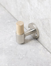 SIGNATURE hook in Brushed Nickel/Oak. Luxury hardware made of solid brass by BRANDT Collective.