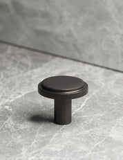 EDGE Knob in Burnished Brass. Elegant cabinet hardware designed by BRANDT Collective.