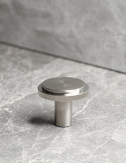 EDGE Knob in Brushed Nickel. Elegant cabinet hardware designed by BRANDT Collective.