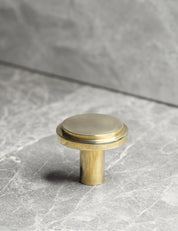 EDGE Knob in Polished Brass. Elegant cabinet hardware designed by BRANDT Collective.