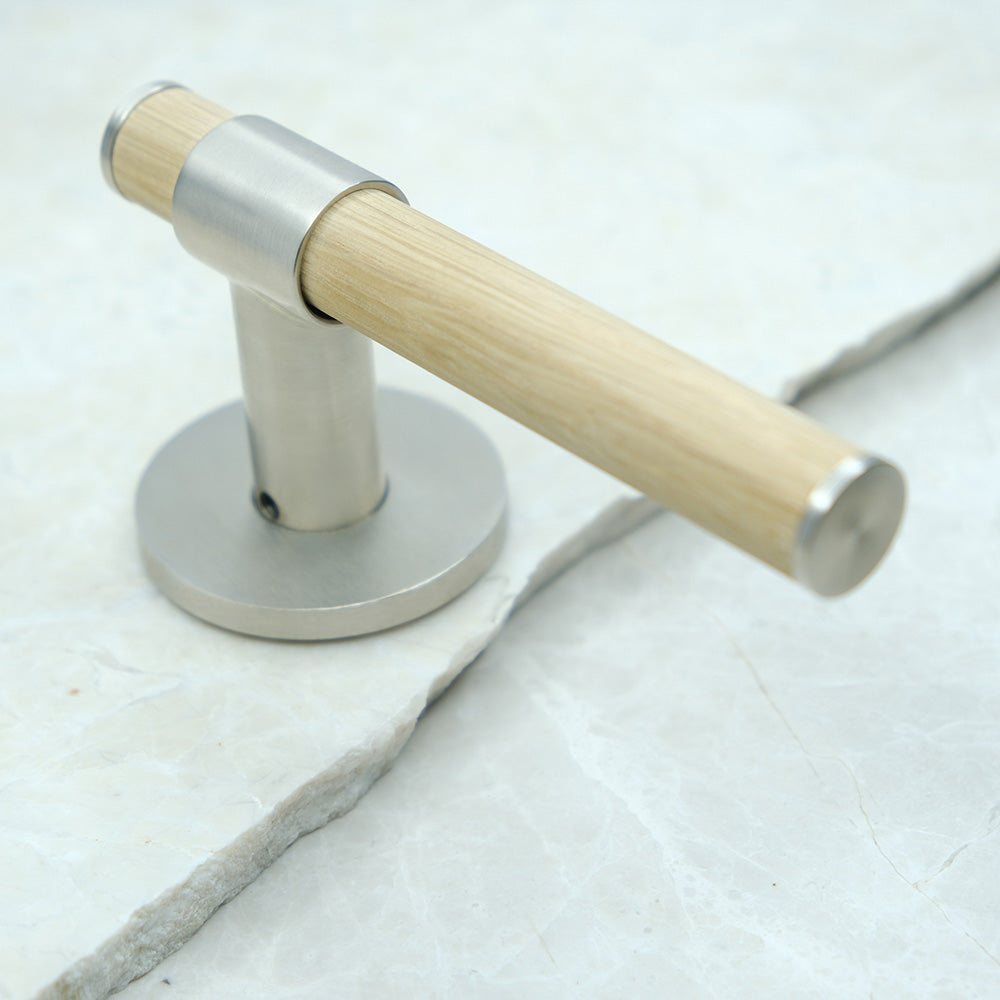 END door handle in Brushed Nickel/Oak. Luxury door hardware made of solid brass by BRANDT Collective.