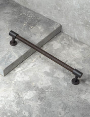 REFINED END pull bar 186 mm in Nearly Black/Wenge. Modern cabinet hardware made of solid brass by BRANDT Collective.