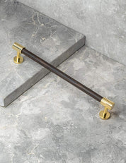 REFINED END pull bar 186 mm in Polished Brass/Wenge. Modern cabinet hardware made of solid brass by BRANDT Collective.