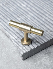 REFINED T-bar 54 mm in Brushed Brass/Brushed Brass. Modern kitchen hardware made of solid brass by BRANDT Collective.