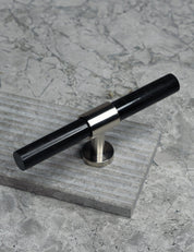 SIGNATURE 20 T-bar 113 mm in brushed nickel and black horn by BRANDT Collective luxury cabinet hardware