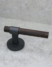 SIGNATURE door handle in Nearly Black/Wenge. Modern door hardware made of solid brass by BRANDT Collective.