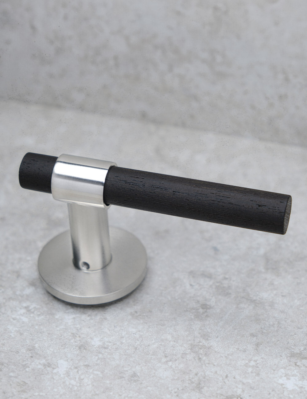 SIGNATURE door handle in Brushed Nickel/Wenge. Modern door hardware made of solid brass by BRANDT Collective.