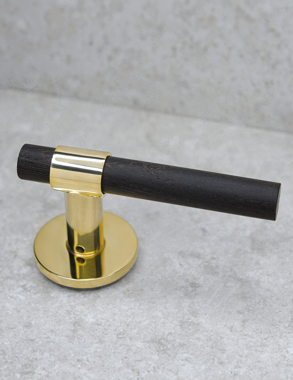 SIGNATURE door handle in Polished Brass/Wenge. Modern door hardware made of solid brass by BRANDT Collective.