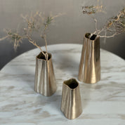 TRUNK vase in satin brass. Designed by Julie Brandt for BRANDT Collective