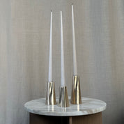 TRUNK candleholder in satin brass. Designed by Julie Brandt for BRANDT Collective